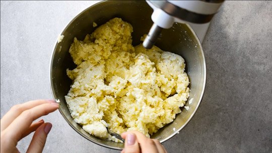 potato and cheese pierogi filling in a metal bowl