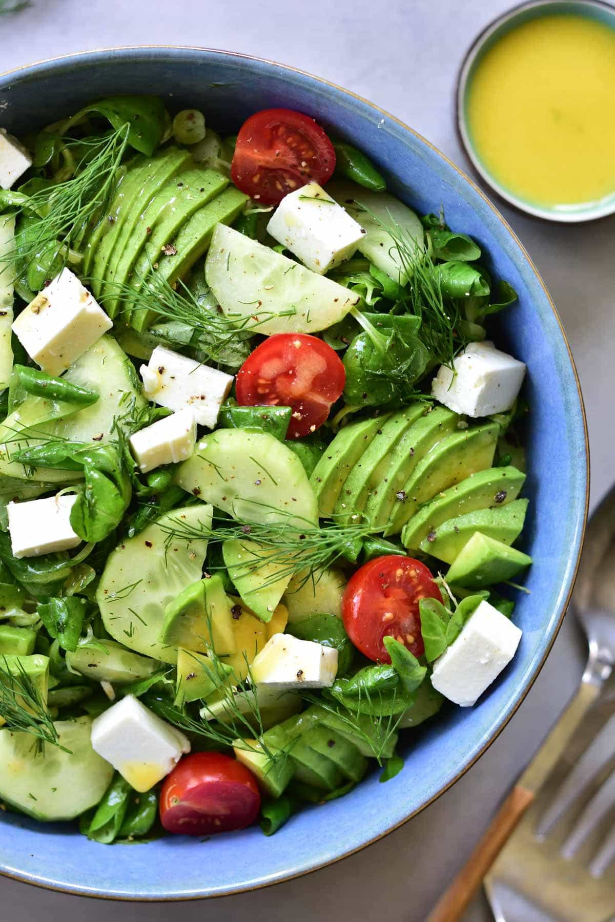 close up shot on cucumber avocado tomato salad