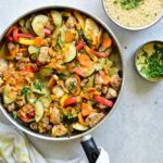 moroccan chicken with apricots and vegetables in a pan