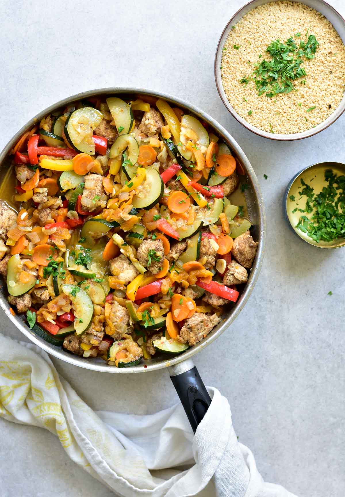 moroccan chicken with apricots and vegetables in a pan