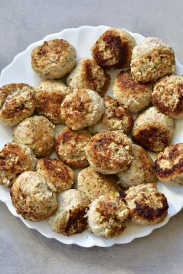 pan-fried ricotta meatballs on a plate