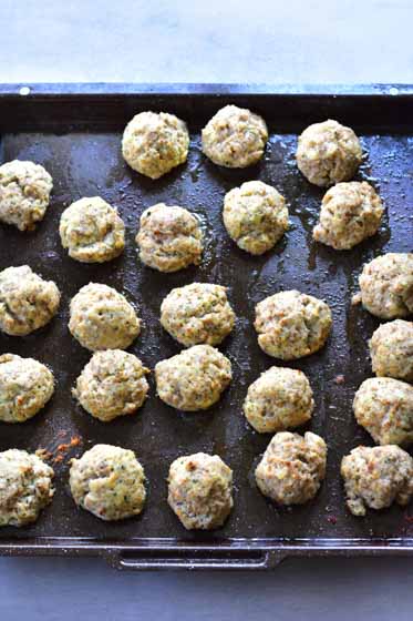 roasted ricotta meatballs on a roasting tray