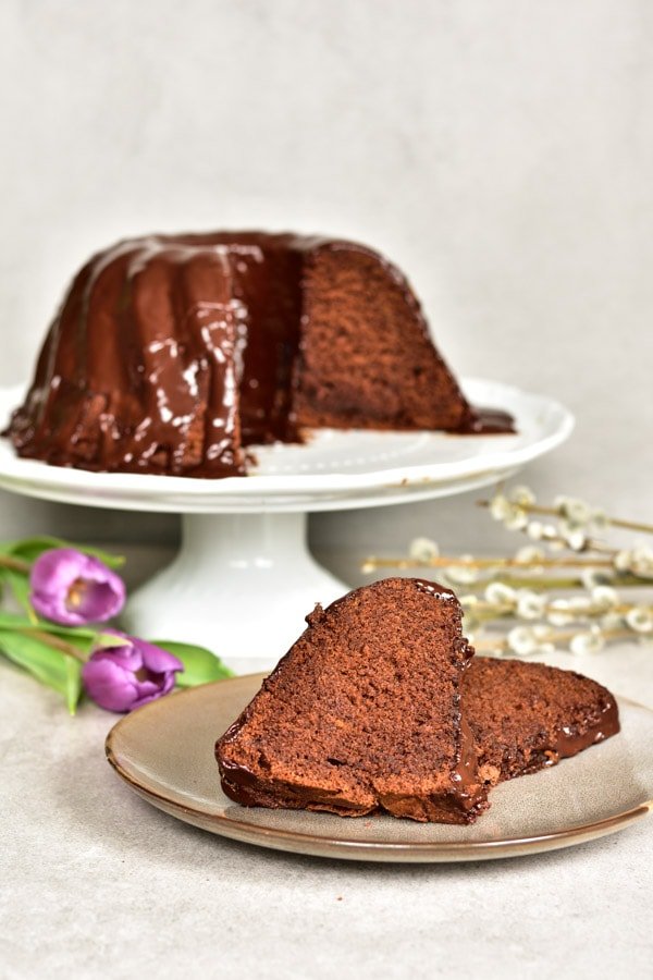 a piece of chocolate orange bundt cake on a plate