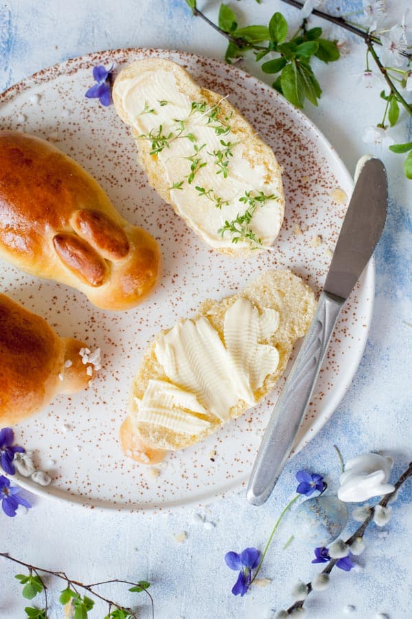 Easter bunny rolls cut in half and spread with butter