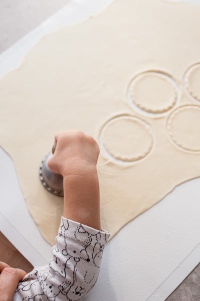 cutting out rounds in a pierogi dough