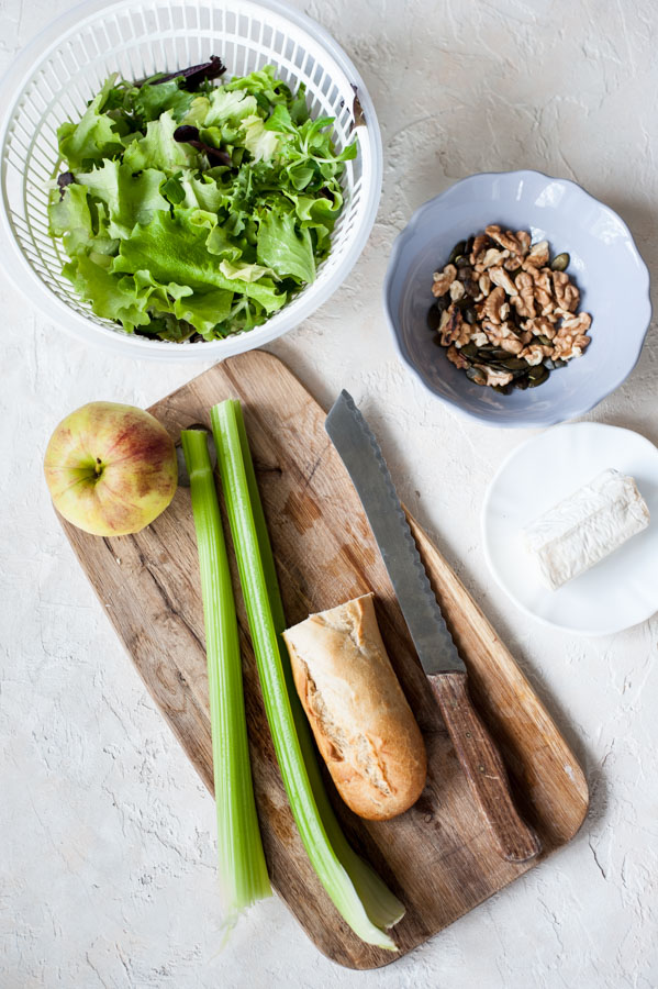Ingredients needed to prepare Apple celery salad with walnuts and goat cheese.