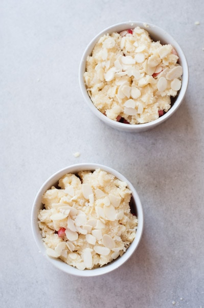 rhubarb covered with almond crumble in two small rameking (unbaked)