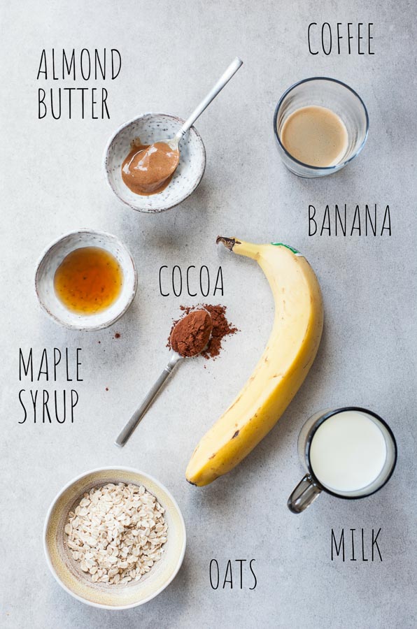 Labeled ingredients for coffee banana smoothie on a table.