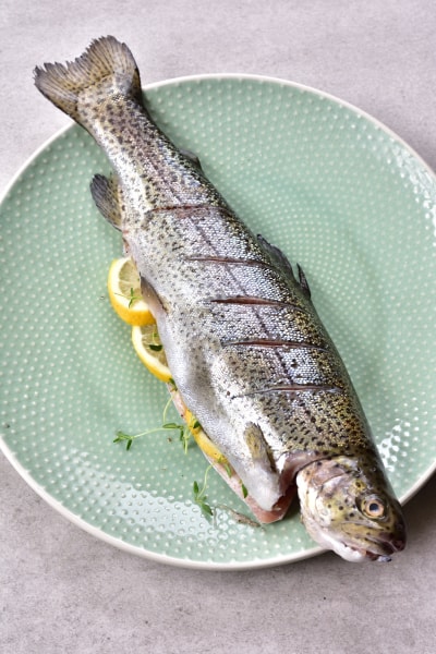 Whole trout stuffed with lemon, thyme and garlic