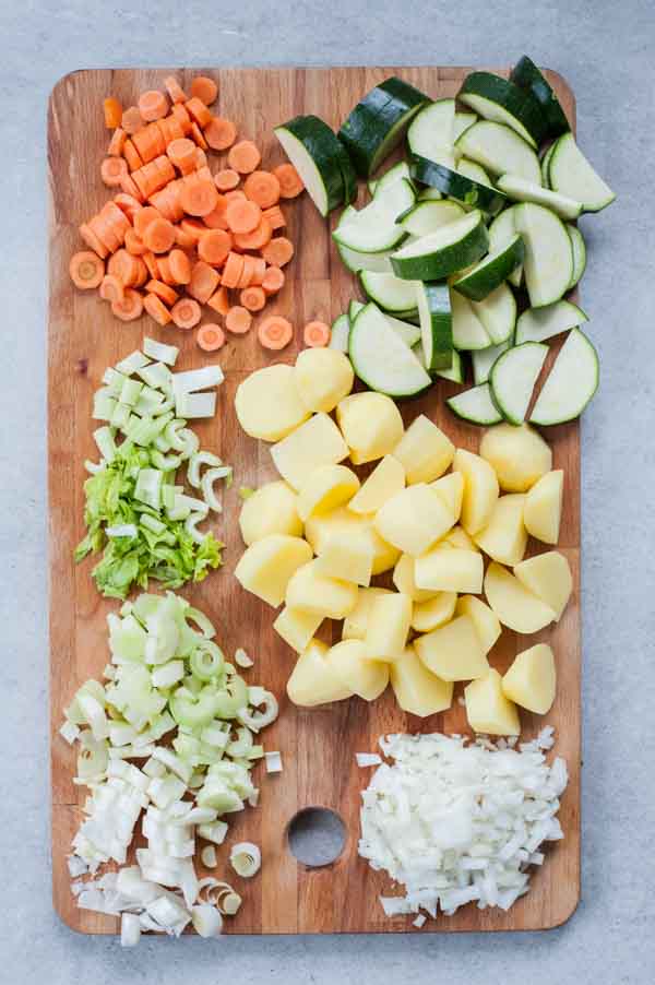 chopped vegetables for pistou soup on a chopping board