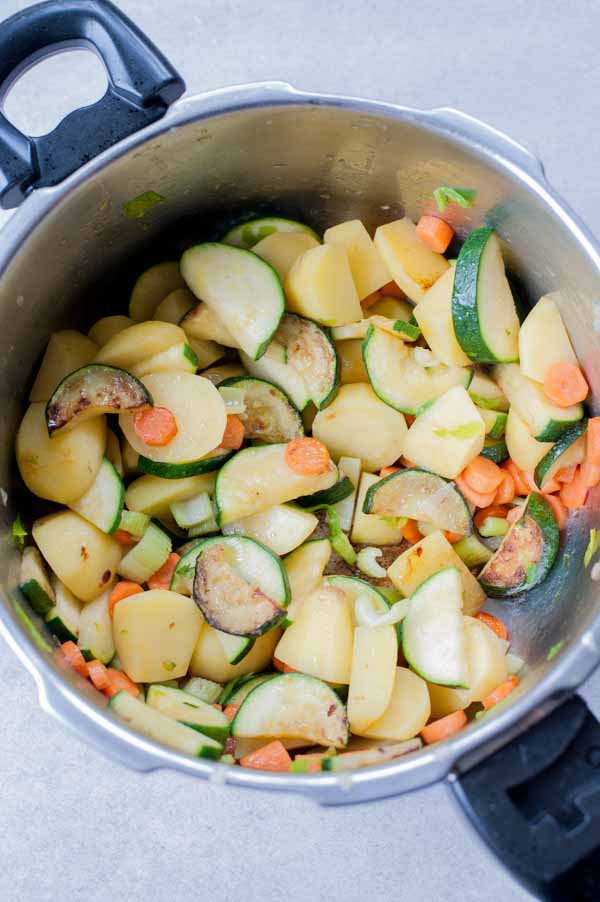 browned vegetables in a pot