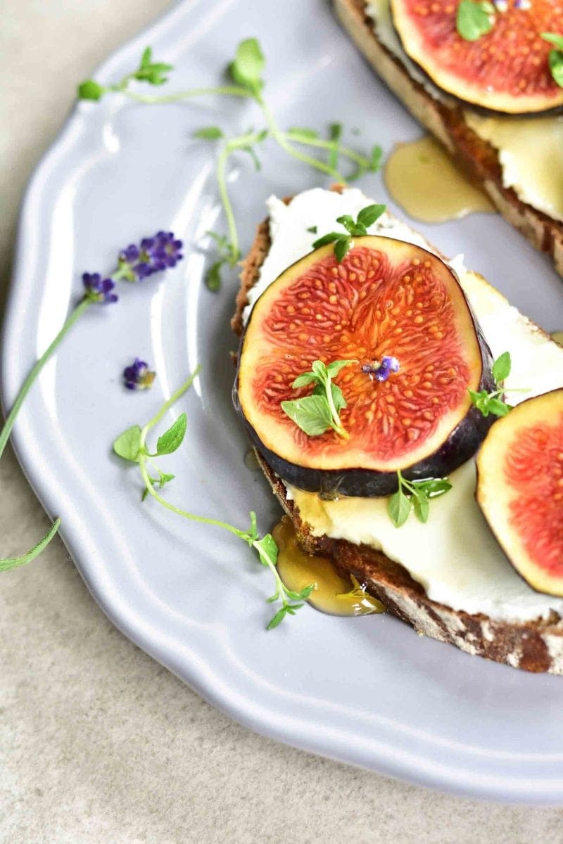 close up shot on fig and goat cheese toast