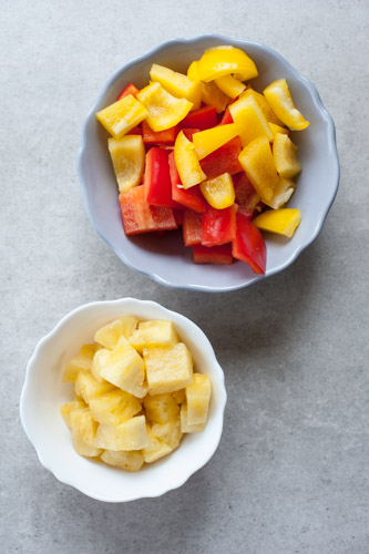 chopped pineapple and bell paprika in a bowl