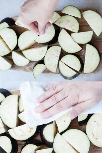 eggplant slices are being salted and patted dry with paper towels