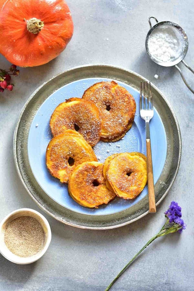 pumpkin pie apple ring pancakes on a blue plate