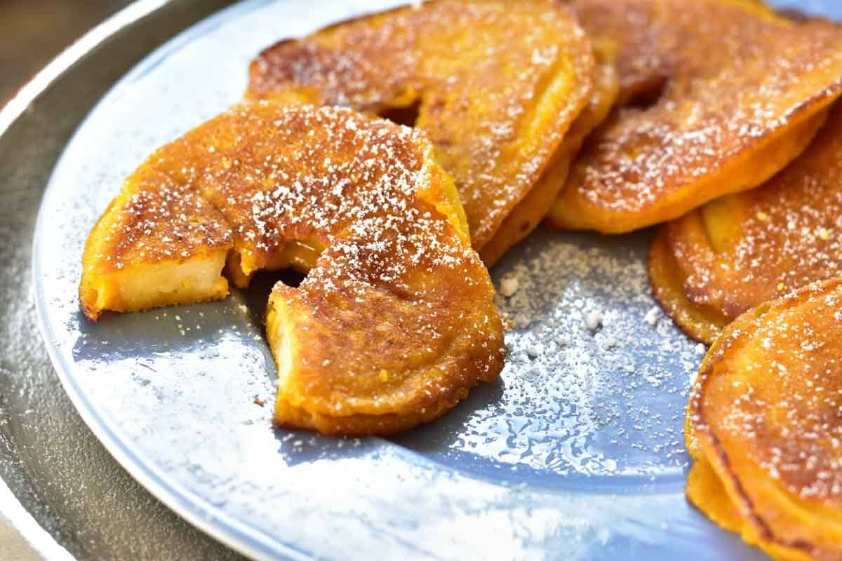 close up shot on apple ring pancakes on a plate