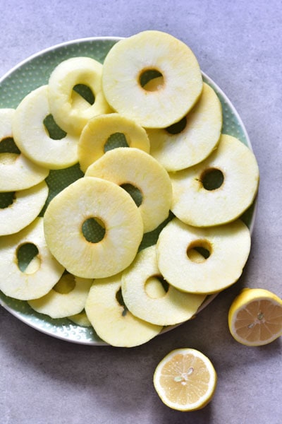 apple ring sprinkled with lemon juice on a plate