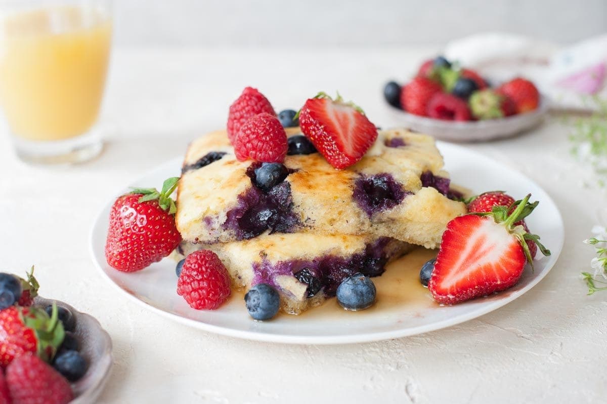 lemon blueberry sheet pan pancakes on a plate