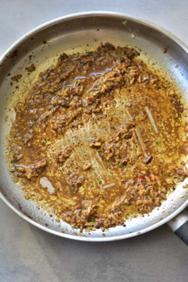 brown bits at the pottom of the pan with wine added