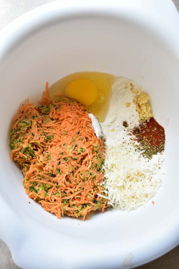 prepared fritter ingredients in a white bowl