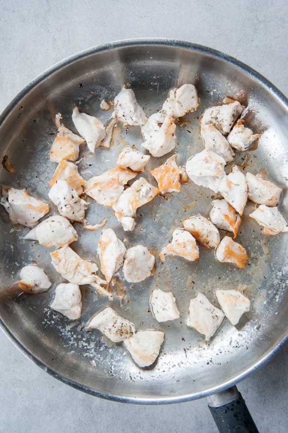 pan-fried chicken breast pieces on a pan