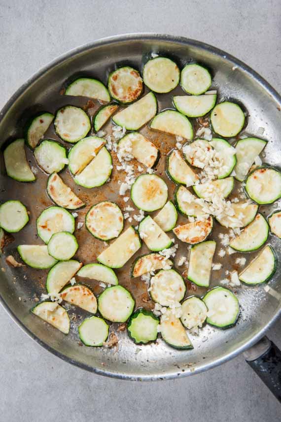 pan-fried zucchini and garlic on a pan