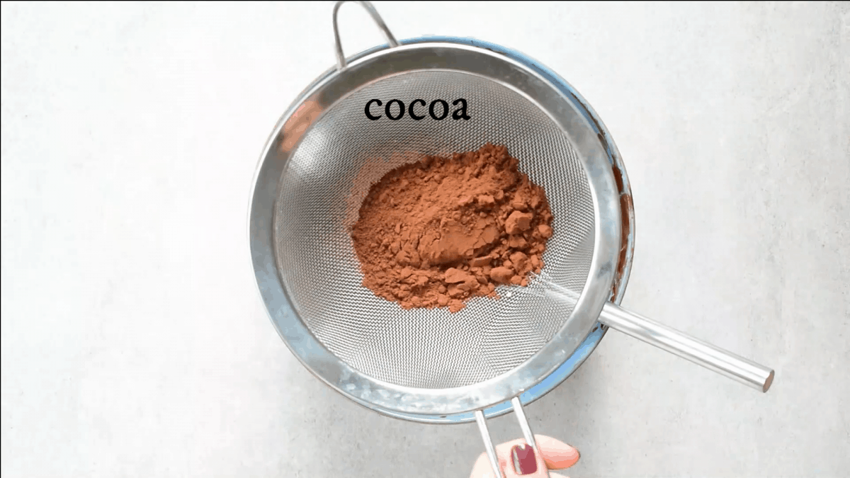 cocoa is being sifted in a sieve