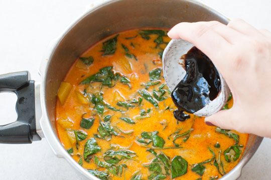 Thai red curry is being seasoned