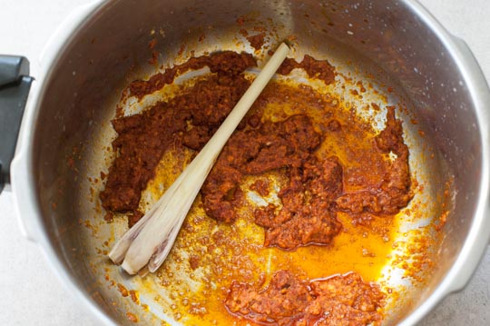 red curry paste and lemongrass in a pot