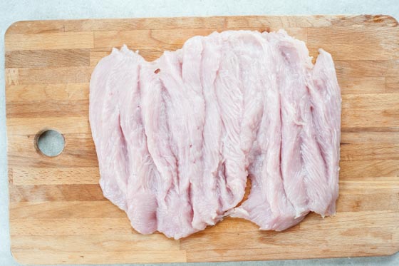 butterflied turkey breast on a chopping board