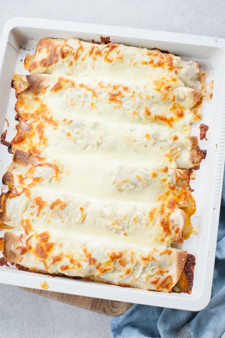 Cheesy vegetable crepes on a baking tray
