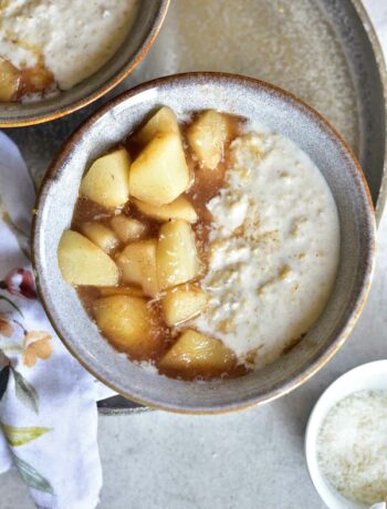 coconut oatmeal with syrupy pears in a grey bowl