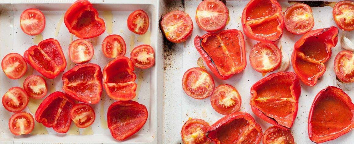 roasted tomatoes and bell paprika on a white sheet pan