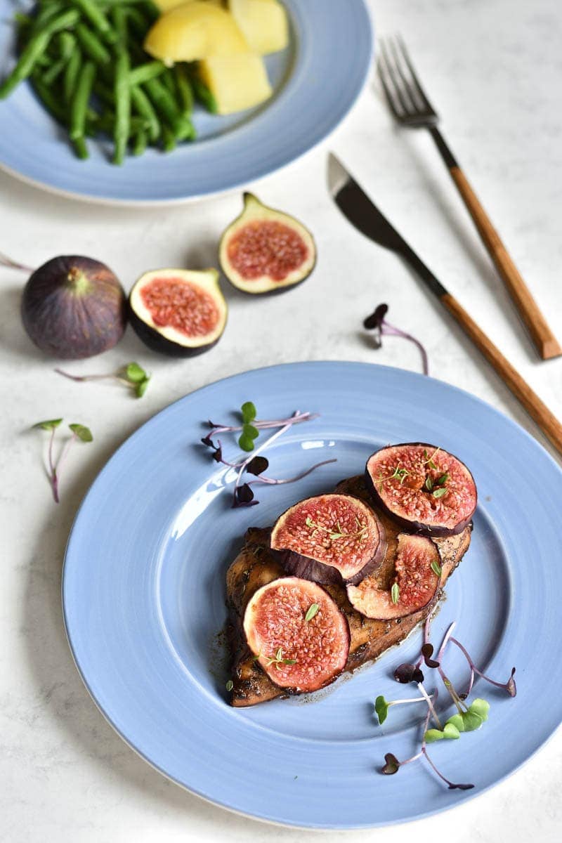 balsamic chicken with figs on a blue plate