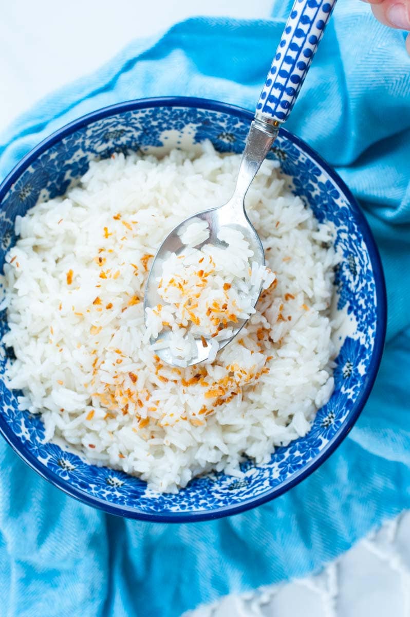 coconut rice scooped on a tablespoon