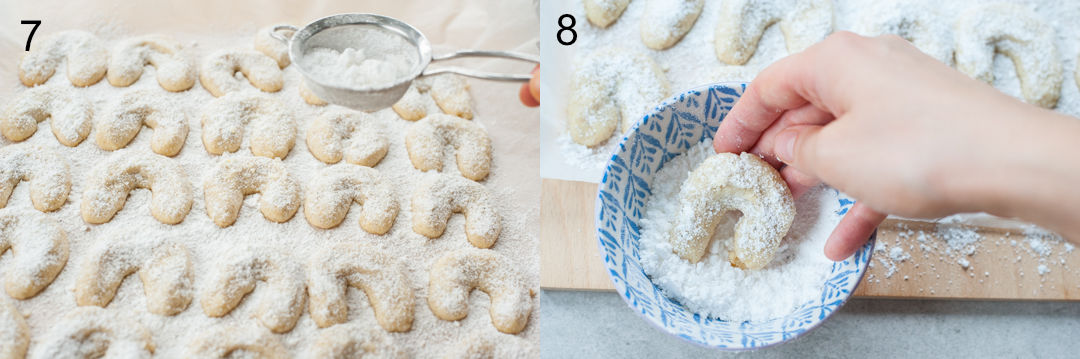 Vanillekipferl cookies are being dusted with powdered sugar.