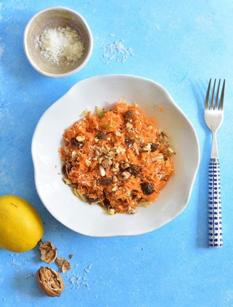 Carrot apple salad with raisins, cinnamon, walnuts, and coconut