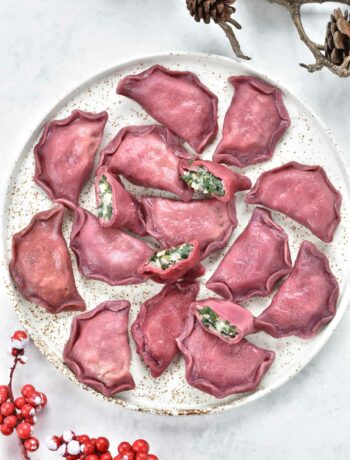 pink pierogi with spinach and potato filling