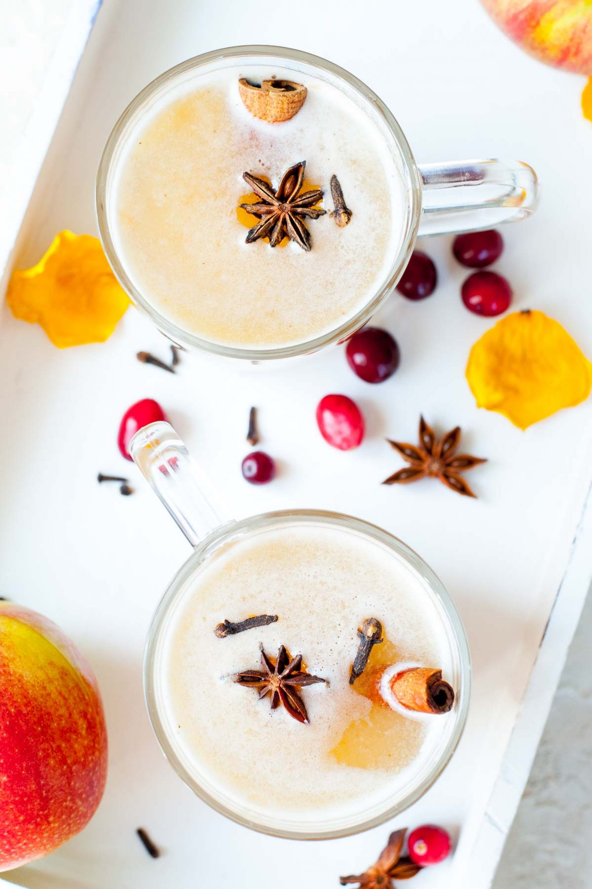 Overhead photo of 2 glasses with mulled apple cider.