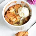 rhubarb crumble with almonds in a small white ramekin