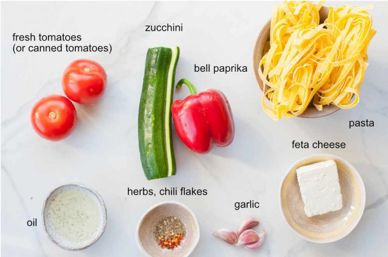 Pasta with zucchini, red bell pepper, tomatoes, and feta cheese