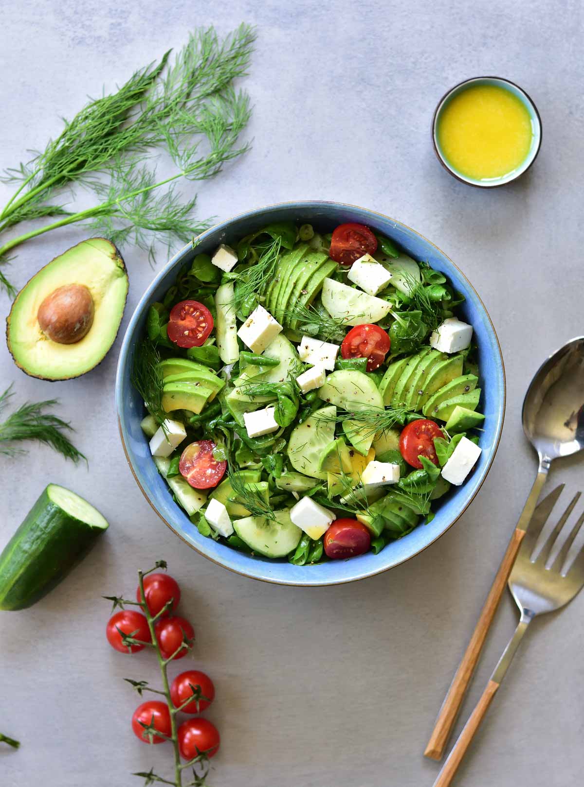 Cucumber avocado tomato salad with dill and feta