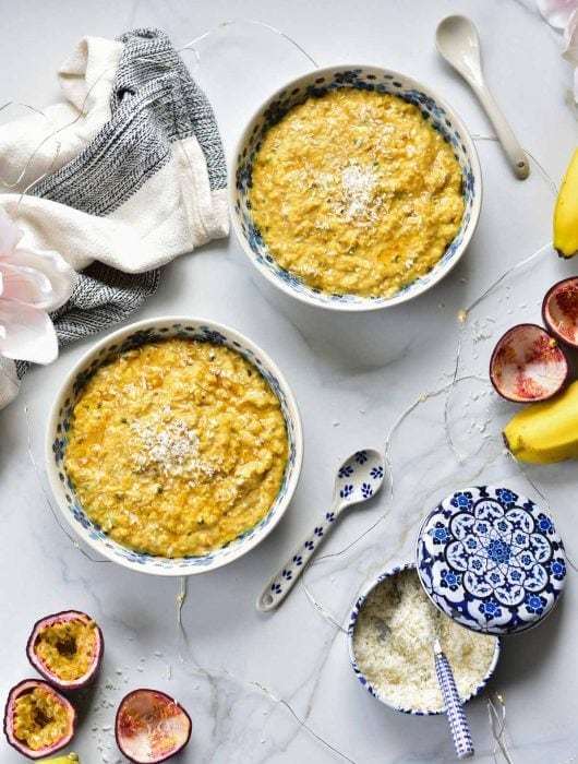 two bowls with banana oatmeal with passion fruit