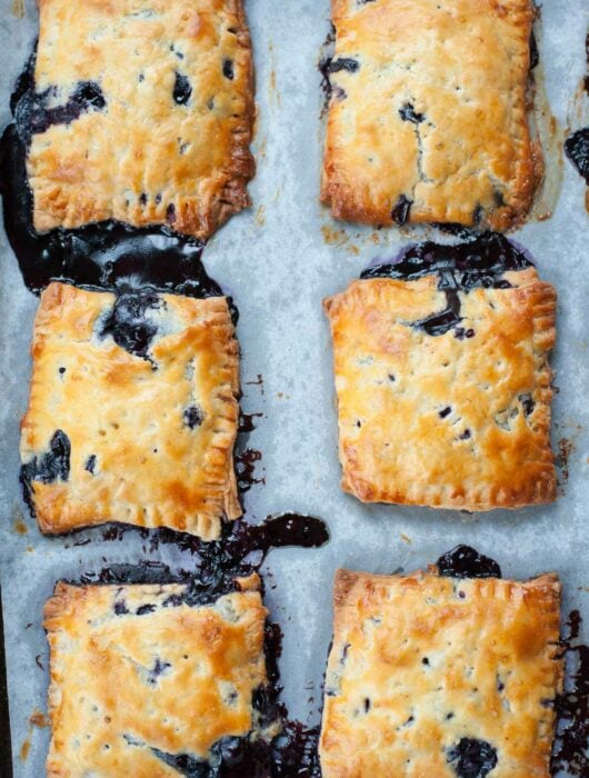 blueberry hand pies on a baking tray