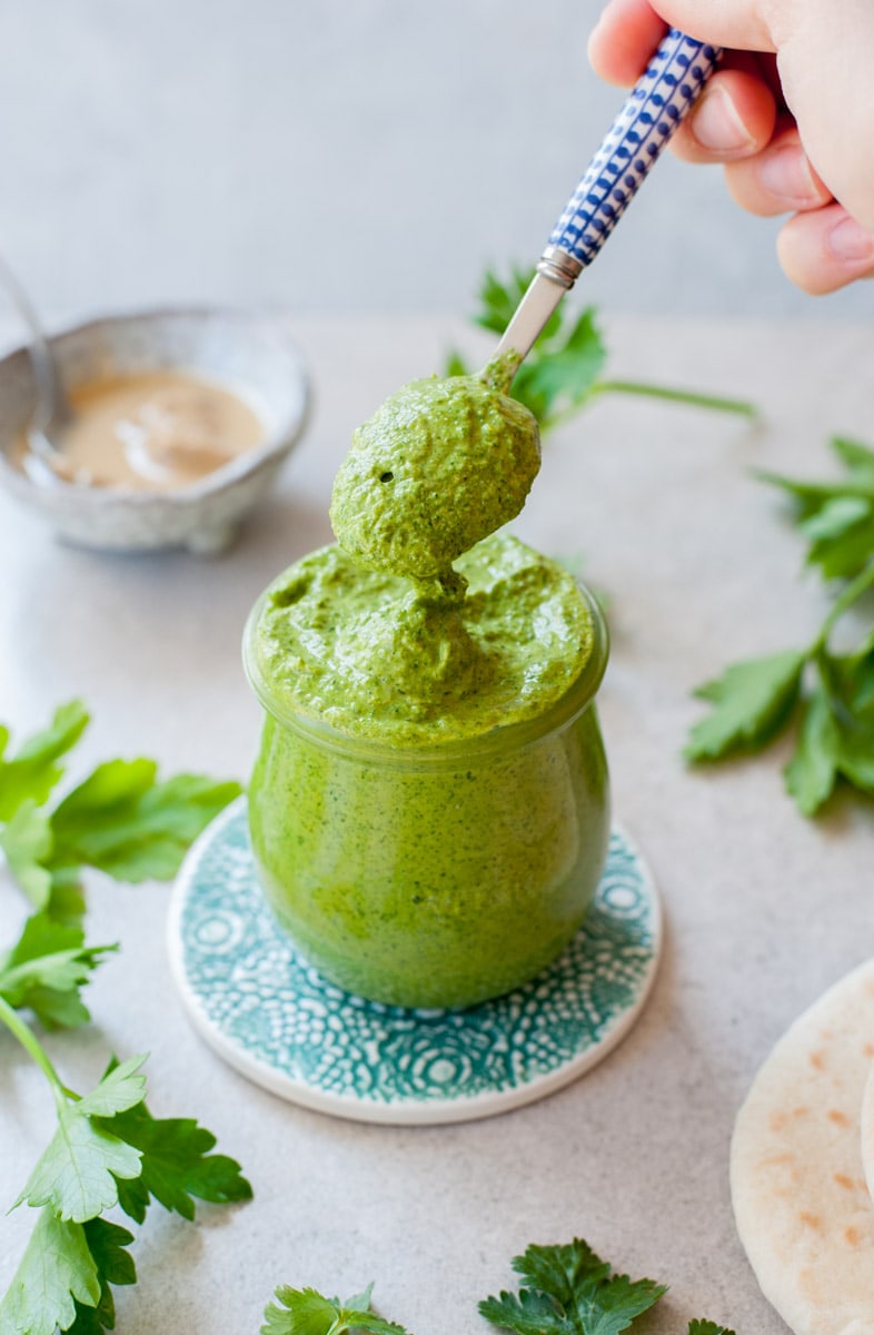 green tahini sauce in a jar