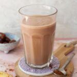 chocolate peanut butter banana smoothie in a glass