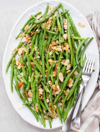 green beans almondine in a large white plate