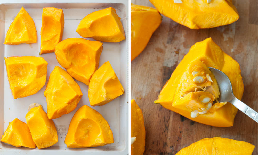 Pumpkin cut into pieces on a white baking sheet. Scooping out the pumpkin seeds with a spoon.