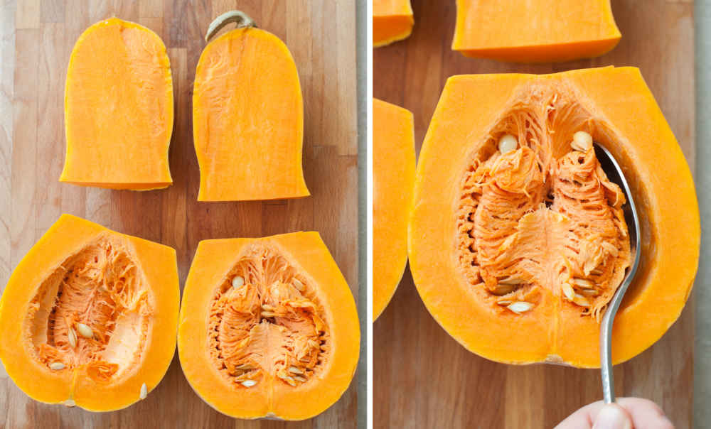 Cut into 4 pieces butternut squash on a chopping board. Scooping out the butternut squash seeds with a spoon.