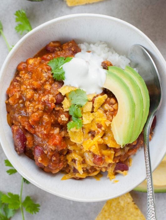 Turkey pumpkin chili in a white bowl.